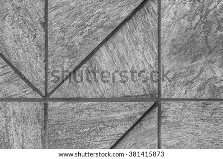 Marble exterior wall in tones of black, white, and gray/grey.
