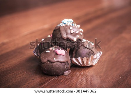 Chocolate balls topping with a sugar resin. Vintage color tone.