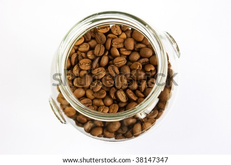 Jar of brown roasted coffee beans