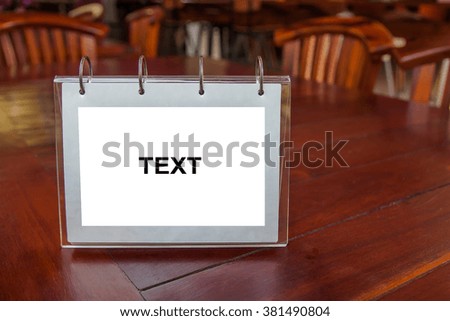 White label for text or image is placed on the table, White space for text or photos, such as food items, food photos, advertisements and more.