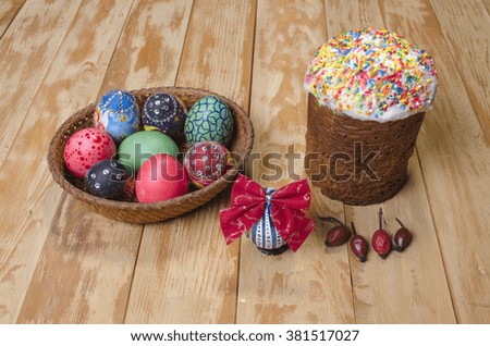 the ornamented eggs with Easter on a wooden table