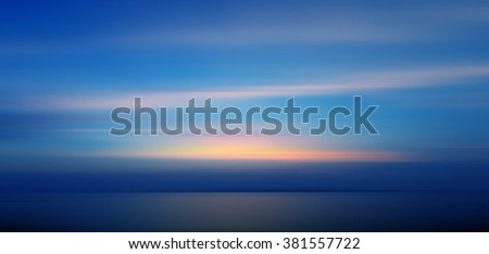 Motion blurred background of refraction in the sea at twilight times.