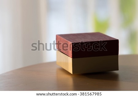 gift box on wooden table on light background