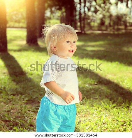 Toned Photo of Happy Child in the Summer Park