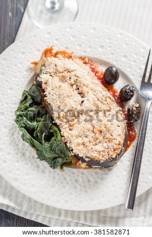 salmon with breadcrumbs, olives and spinach