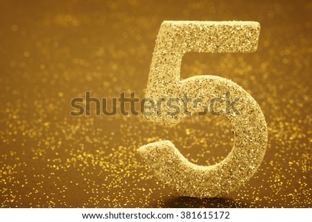 Number five golden color over a warm background. Anniversary. Horizontal