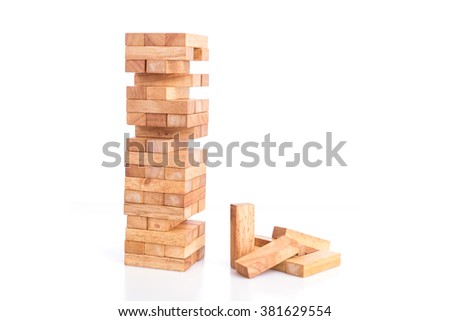 Close up blocks wood game (jenga) isolated on white background Royalty-Free Stock Photo #381629554