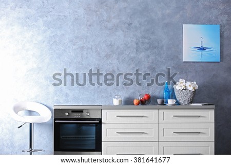 Modern kitchen furniture in the grey interior