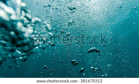 Underwater air bubbles in the clean blue deep ocean