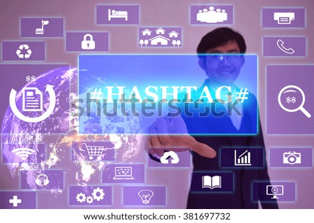 HASHTAG concept  presented by  businessman touching on  virtual  screen ,image element furnished by NASA