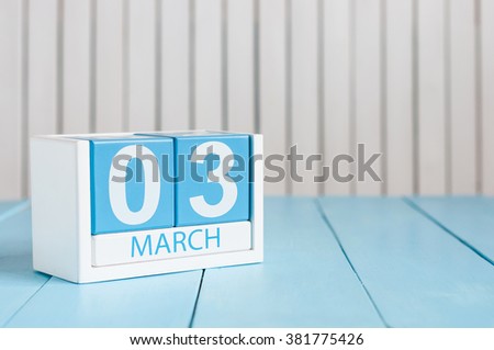 March 3rd. Image of march 3 wooden color calendar on white background.  Third spring day, empty space for text