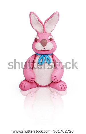 Easter pink plasticine bunny rabbit on a white mirror background