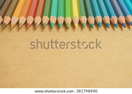 color pencils on craft paper background