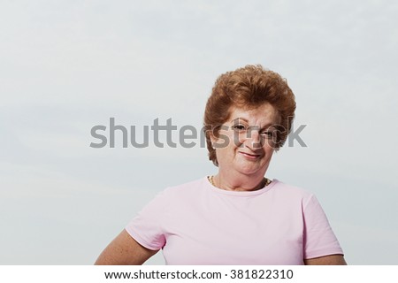 Senior woman wearing a pink t-shirt
