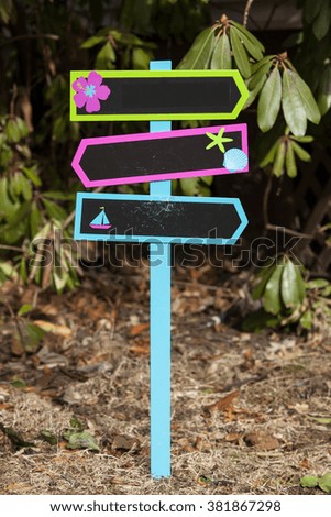 A chalkboard yard stake sign decoration for the summer
