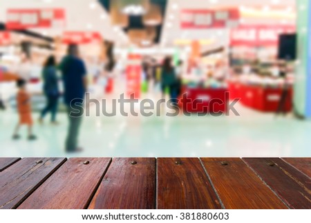Look out from the table, blur image in the mall as background.