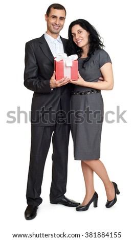 Couple with gift box, studio portrait on white. Dressed in black suit.