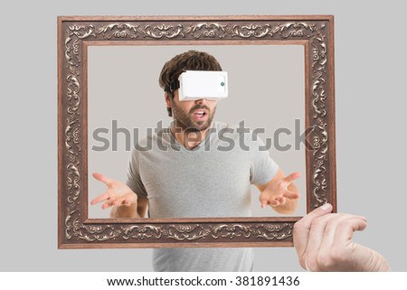  man using virtual reality goggles inside the frame