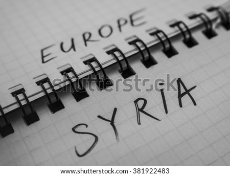Sign of border and barbed wire fence between words - europa and refugees from syria