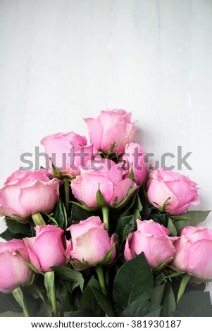 Bouquet of Beautiful Pink Roses on White Wooden Background, shallow DOF, selective focus