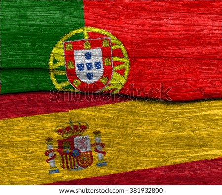 protugal and spain flag on old wood texture pattern background