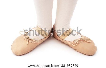 Child with ballet slipper on a isolated white background.