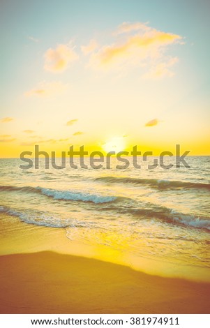 Beautiful Sunset with sea and beach - Vintage and sunflare filter effect