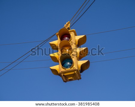 Retro style yellow traffic light.