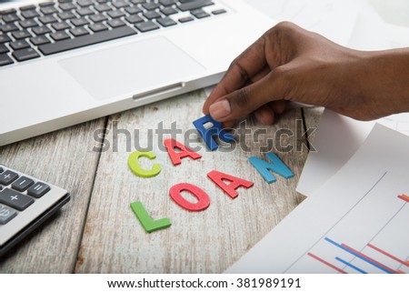 hand arranging car loan concept photo