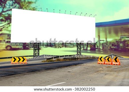 billboard on bridge with blur gas station background