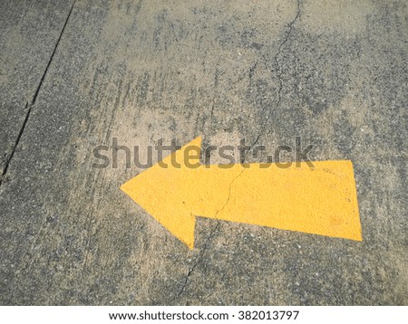 traffic arrow sign on the floor