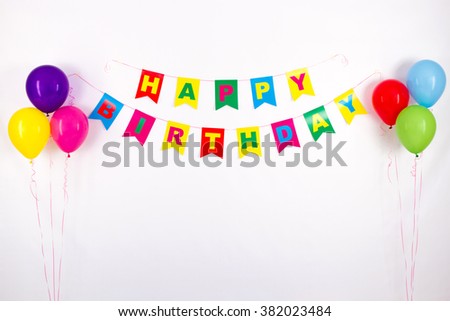 colorful garlands, streamer, party hats and confetti. festive decoration background with sample