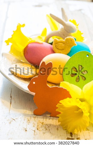 Rustic easter holiday concept with easter bunny and eggs