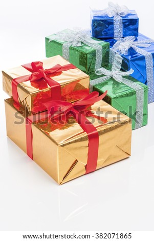 Celebration Concepts. Many Colorful Wrapped Up Gift Boxes Standing In Line Together. Against White. Vertical Image