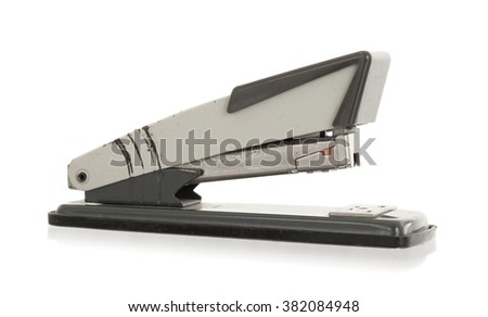 Close-up of an old rusty vintage stapler, isolated on white