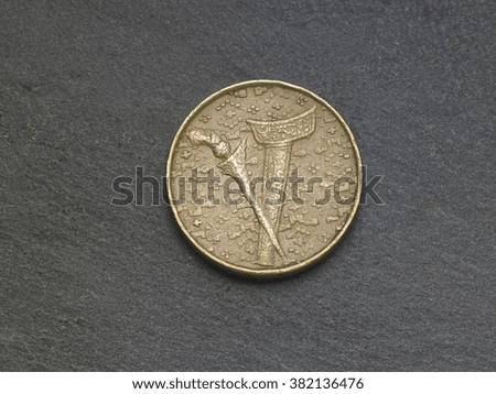 coin on the black slate