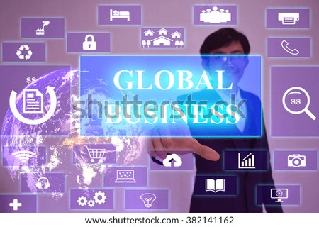 GLOBAL BUSINESS  concept  presented by  businessman touching on  virtual  screen ,image element furnished by NASA