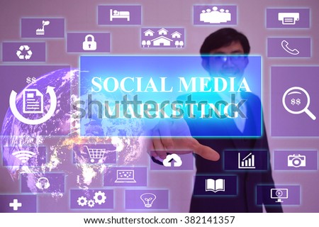 Social Media Marketing  concept  presented by  businessman touching on  virtual  screen ,image element furnished by NASA