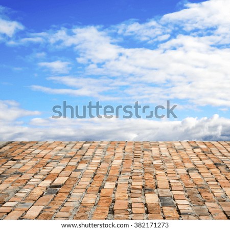red brick floor against the sky