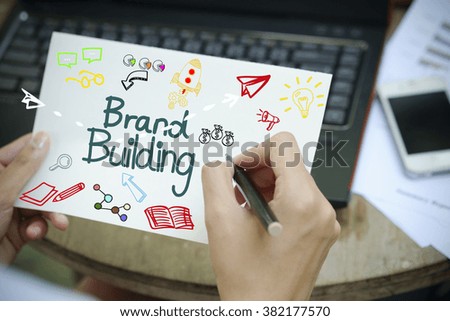 hand drawing BRAND BUILDING concept on white notebook , business concept , business idea
