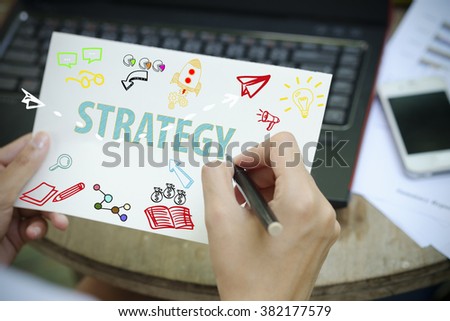 hand drawing STRATEGY concept on white notebook , business concept , business idea