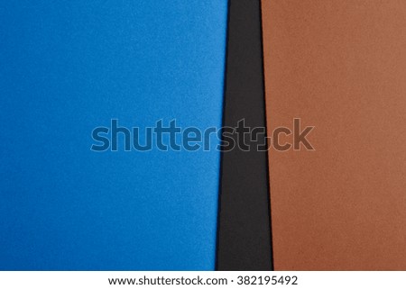 Colored cardboards background in blue, black, brown tone. Copy space. Horizontal