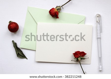 Mockup with envelope, blank card and dry roses.