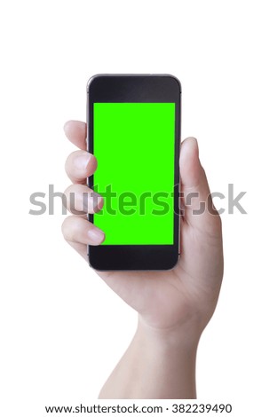 hand with mobile phone with green blank screen on white background