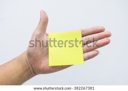 Yellow paper is on the left hand