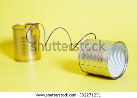 tin can phone.communication concept. Royalty-Free Stock Photo #382271251