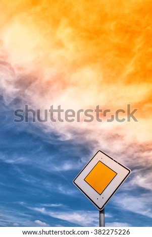 priority road traffic sign with sky and clouds
