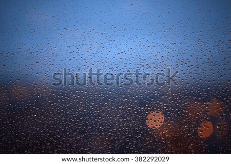 Water drops on glass with bokeh.

