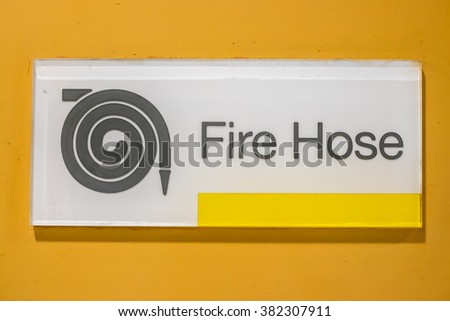 Fire Hose sign on wall