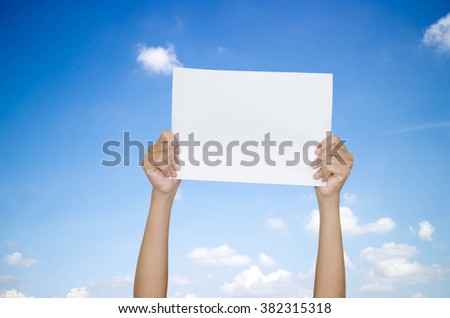 hand paper on sky background.